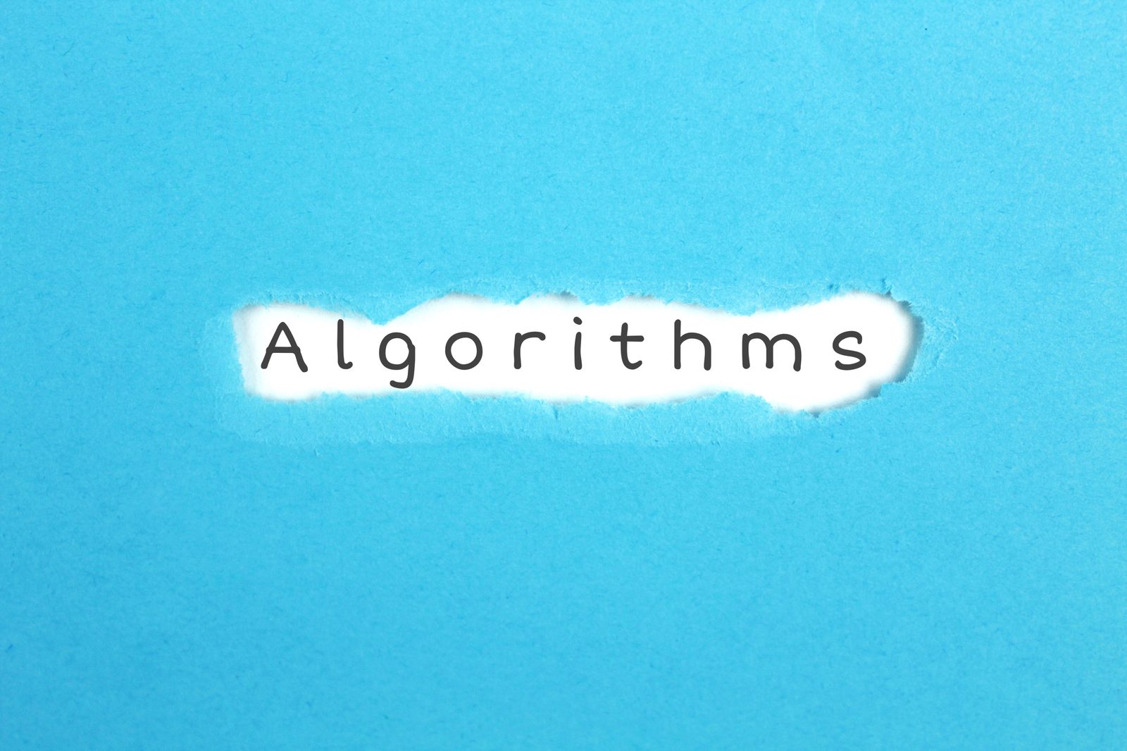 Algorithms typed underneath torn blue paper