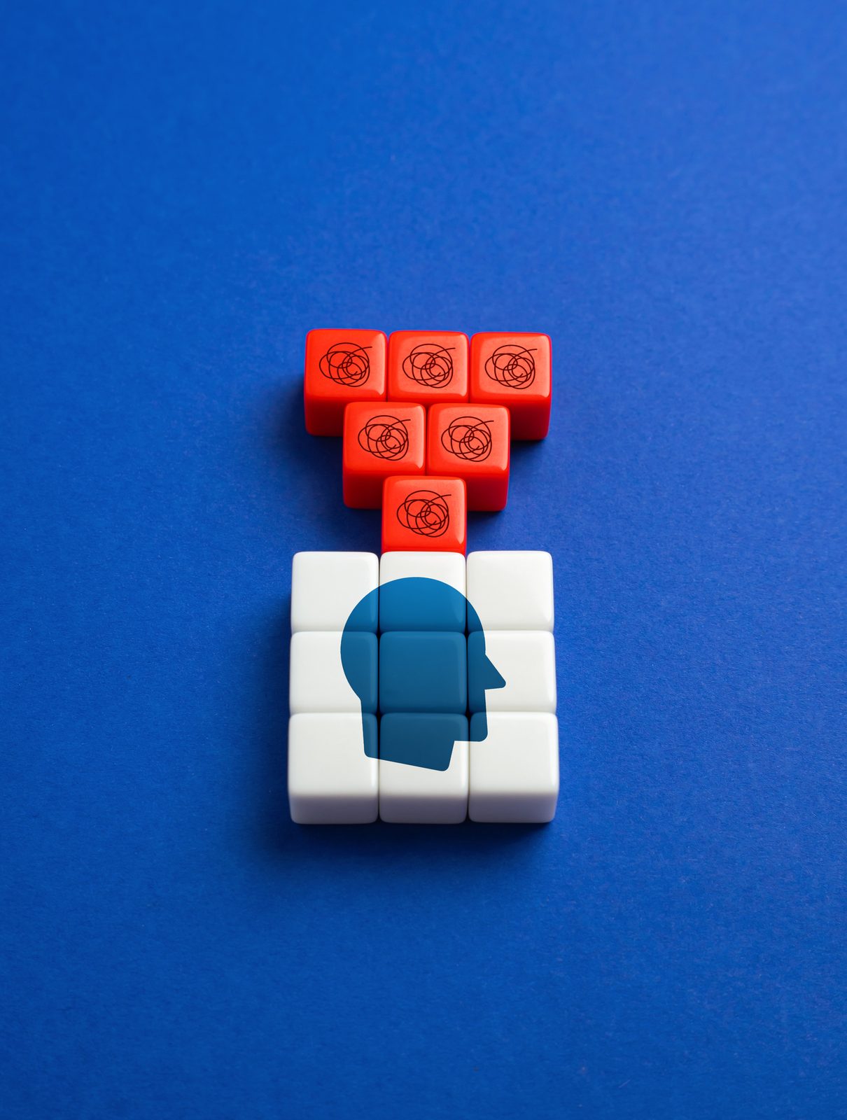 Blocks forming a mind with tangled thoughts above
