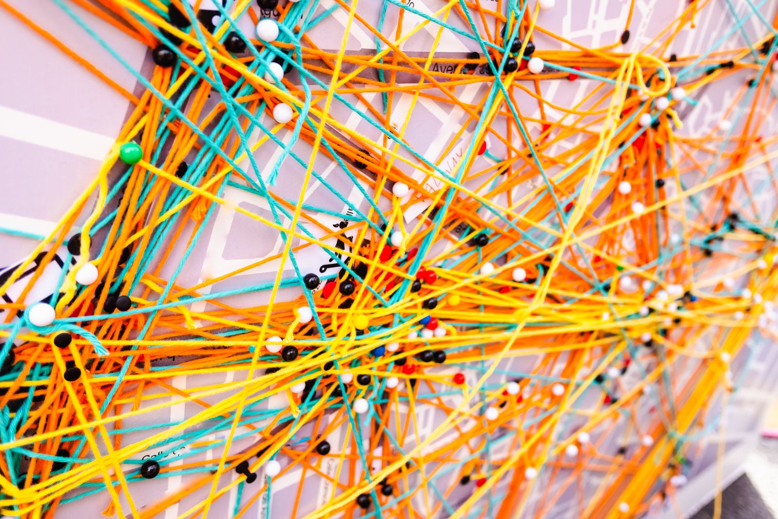 Colorful abstract string art on a city map